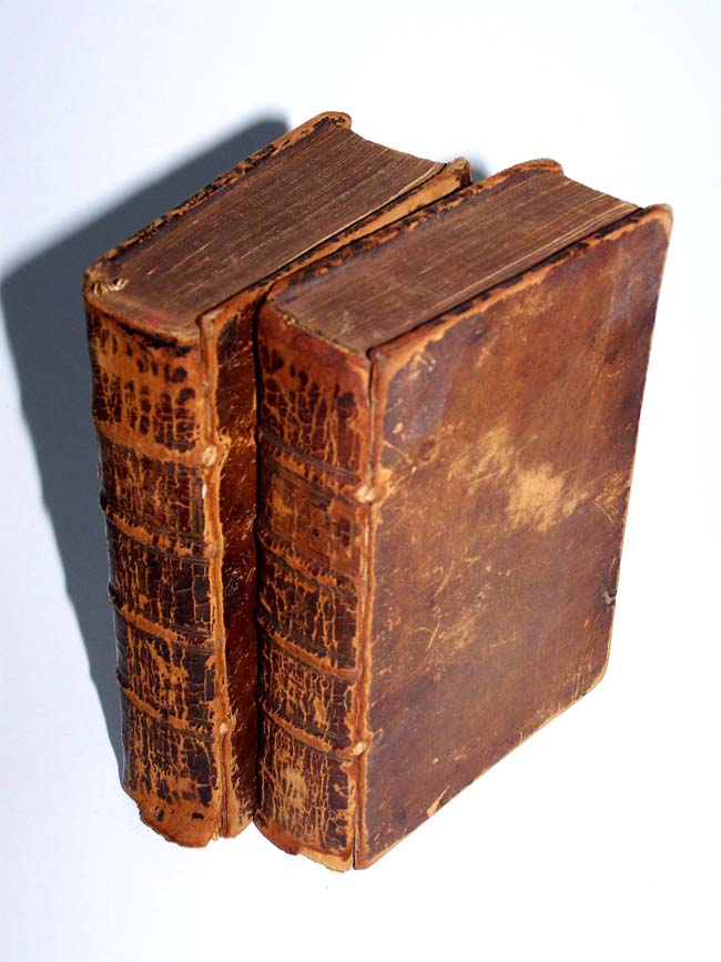 Two Leather bound volumes of the "GUARDIAN" printed in London in 1750 with daily advice given for the dates of March 12, 1713 through October 1, 1713.